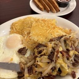 Smothered Hamburger with egg, crisp hash browns and toast. Delicious! Smothered Hamburger with egg, crisp hash browns and toast. Delicious!