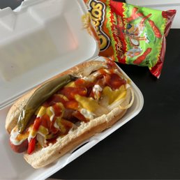 a hot dog in a styrofoam container a hot dog in a styrofoam container