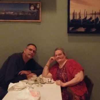 Osteria Rustica - Hubby and I. Taken by owners wife. - Italian Near Me - Bunnell, Florida