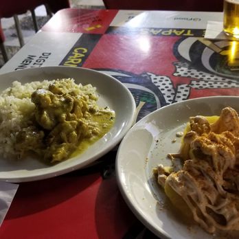 Carmela - Curry chicken and spicy potatoes. - Tapas Bars Near Me - Seville, SE