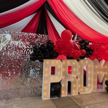 CB Luxe Decor & Events - Balloon garland on silver shimmer wall & PROM marquee letters - Party & Event Planning Near Me