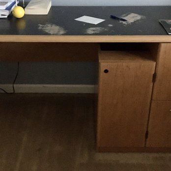 Wright & Davis Hauling - Crammed by a bookshelf (right) and blocked by the corner of a bed frame (not pictured, right) in a tiny room. Still got it out! - Junk Removal & Hauling Near Me