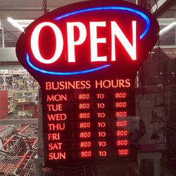 Tractor Supply - Hours of operation posted next to front entrance