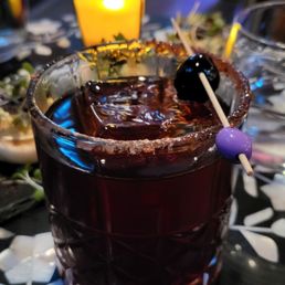 a drink with a toothpick in it a drink with a toothpick in it