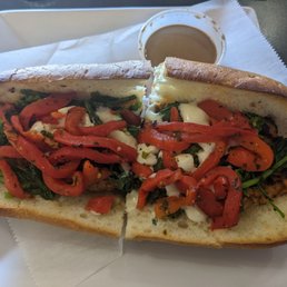 Author Ave Specialty Combo, comes with chicken, broccoli rabe, red peppers, mozzarella, and balsamic vinegar Author Ave Specialty Combo, comes with chicken, broccoli rabe, red peppers, mozzarella, and balsamic vinegar