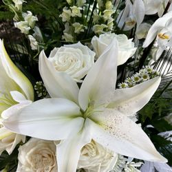 Just For You Florals - Casablanca white Lillie's, white snapdragons, white roses, white basket. Elegant