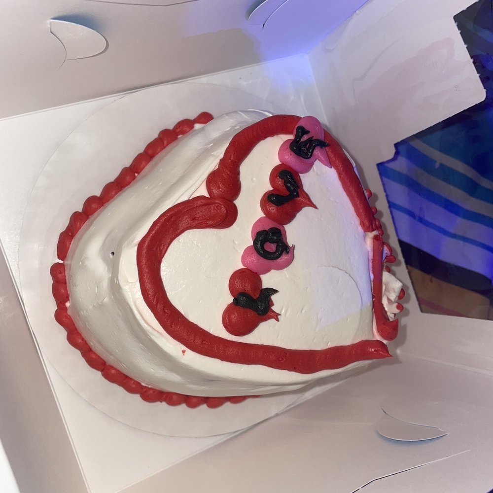 a heart shaped cake in a box