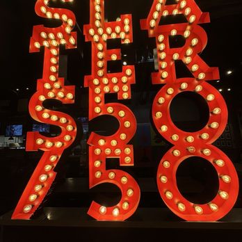 Slater's 50/50 - Front entrance sign behind the host station - Burgers Near Me - Las Vegas, Nevada Slater's 50/50 - Front entrance sign behind the host station - Burgers Near Me - Las Vegas, Nevada