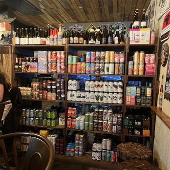 The Filling Station - a woman sitting at a table - Beer, Wine & Spirits Near Me - Nashville, Tennessee The Filling Station - a woman sitting at a table - Beer, Wine & Spirits Near Me - Nashville, Tennessee