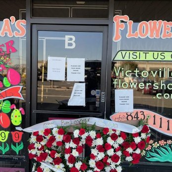Diana's Flowers - A flower arrangement for a child's funeral that should say SON! - Florists Near Me - Victorville, California