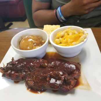 Oley's Kitchen & BBQ - Look at the BBQ sauce on his ribs... Looks awfully familiar right?? Without the pepper flakes of course *rolling my eyes* - Soul Food Near Me - Orlando, Florida Oley's Kitchen & BBQ - Look at the BBQ sauce on his ribs... Looks awfully familiar right?? Without the pepper flakes of course *rolling my eyes* - Soul Food Near Me - Orlando, Florida