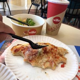 a slice of pizza on a paper plate a slice of pizza on a paper plate