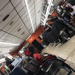 Supremes Barbershop - Full house, happy staff.