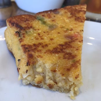 Ulele - Jalapeño cheddar grit cake! With a bite out of it. - New American Near Me - Tampa, Florida Ulele - Jalapeño cheddar grit cake! With a bite out of it. - New American Near Me - Tampa, Florida