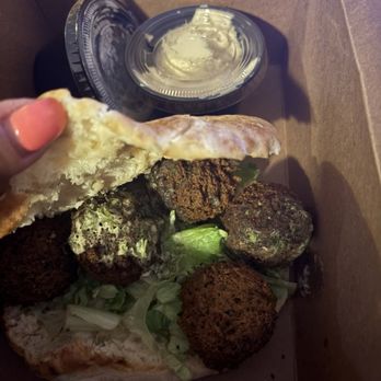 Busboys and Poets - Falafel Sandwich (missing ingredients with old lettuce) - New American Near Me - Washington, DC, District of Columbia