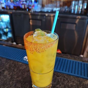 Bar 802 - a glass of orange juice on a bar counter - Lounges Near Me - Stratton, Vermont