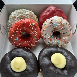 Ruckus Donuts - Boston cream, Homer (strawberry glaze with sprinkles), Vanilla Willy (vanilla with sprinkles), Lime Coconut, Blueberry Lemonade