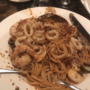 Broccolini - My incredible Fruitii Di Mari Linguini, with clams, mussels, calamri, shrimp. Was incredible sauce. - Italian Near Me - Cooper City, Florida