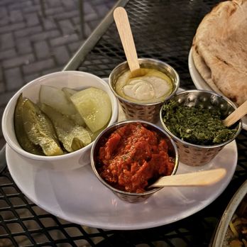 FIYA - Dips & spreads for my Mixed Grill. White: tahini, green: zoug, red: ezme, bowl: pickled cucumber & tomato - Mediterranean Near Me - Chicago, Illinois FIYA - Dips & spreads for my Mixed Grill. White: tahini, green: zoug, red: ezme, bowl: pickled cucumber & tomato - Mediterranean Near Me - Chicago, Illinois