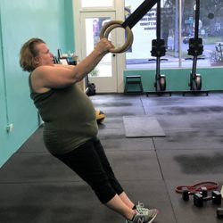 Primal Strength and Conditioning - Sandy working on upper body and core strength with ring rows.