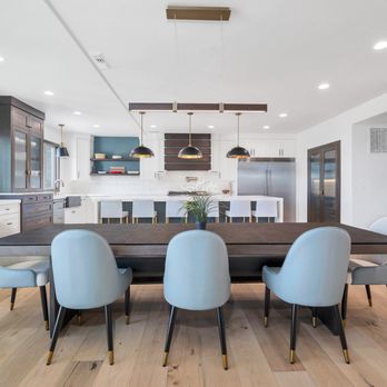 The Flooring Studio - Perfectly placed lighting over island and custom ordered table to fit the lighting, white oak hardwood flooring matching walnut cabinets - Flooring Near Me - St. George, Utah The Flooring Studio - Perfectly placed lighting over island and custom ordered table to fit the lighting, white oak hardwood flooring matching walnut cabinets - Flooring Near Me - St. George, Utah