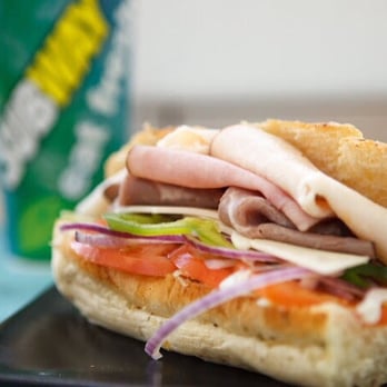 Subway - a sub sandwich on a plate with a drink in the background - Fast Food Near Me - Elkview, West Virginia