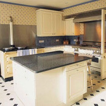 Craft Interiors - a kitchen with a black and white checkered floor - Flooring Near Me - Piqua, Ohio