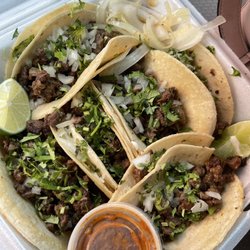 Tienda Mexicana El Mercadito - Six carne asada tacos. So good I ate one before I left the parking lot.