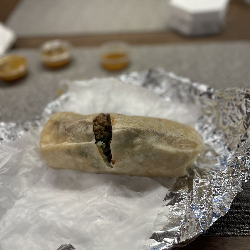 Steak burrito, comes with beans lettuce, tomato
