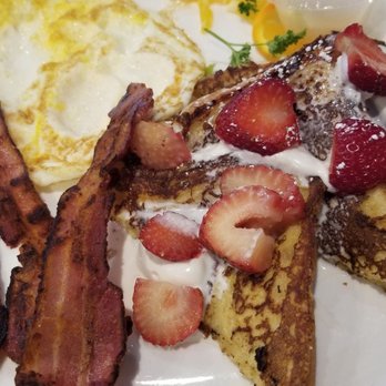 JP’s Bistro - Strawberries and creme French toast combo with eggs fried over hard and bacon - American Near Me - Martinez, California JP’s Bistro - Strawberries and creme French toast combo with eggs fried over hard and bacon - American Near Me - Martinez, California
