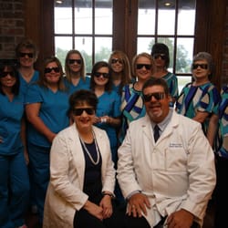 Thomas Vision Clinic - Drs. & Staff showing that the after dilation eye shades are very stylish!