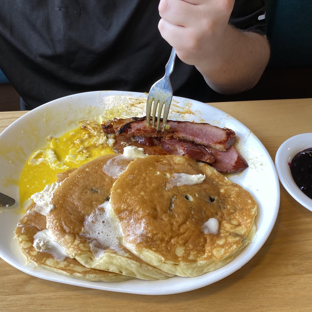 Pig 'N Pancake - Ham and Eggs with blueberry pancakes. Fiancé couldn't wait for me to take a good pic! - Breakfast & Brunch Near Me - Newport, Oregon