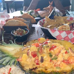 Pina rellenda, complementary chips, empanadas and papas fritas (fries) Pina rellenda, complementary chips, empanadas and papas fritas (fries)