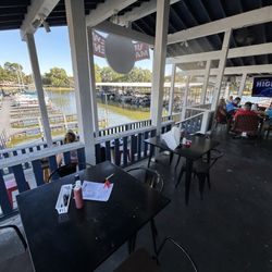 Kc’s On The Lake - Back patio, with TVs and a view of the marina