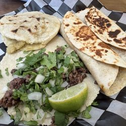 Gorditas Loli's - Steak Taco with hand-made tortilla, chicharron verde gordita, and 2 deshebrada burritos (1 red, 1 green)
