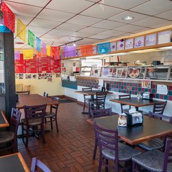 Tavial Grill - Tavial Grill interior with over the counter service and indoor seating.