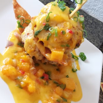 Longboards - Two crab cakes stacked on a wonton chip with a papaya mango dressing. Simply delish. - Bars Near Me - Kapolei, Hawaii