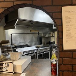 Afghan Awasana Kabob - The window where you order your food and the kitchen in the background.