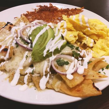 Broken Yolk Cafe - Chilaquiles with green sauce. Two eggs + avo (add on). Spicy and delish! - Breakfast & Brunch Near Me - Orange, California Broken Yolk Cafe - Chilaquiles with green sauce. Two eggs + avo (add on). Spicy and delish! - Breakfast & Brunch Near Me - Orange, California