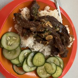 Humbert's Meats - The amazing flank steak from Humberts - a classic teriyaki marinade, grilled and served over rice with a side of pickled cucumbers!