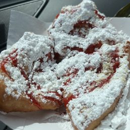 a plate of beignets with powdered sugar a plate of beignets with powdered sugar