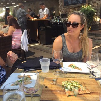 Miramonte Winery - Flatbread under the sunshade patio seating of their Flower Hill Bistro - Wineries Near Me - Temecula, California Miramonte Winery - Flatbread under the sunshade patio seating of their Flower Hill Bistro - Wineries Near Me - Temecula, California
