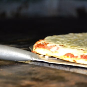 Keith's Pizza-South - a pizza being cooked in an oven - Pizza Near Me - Bemidji, Minnesota Keith's Pizza-South - a pizza being cooked in an oven - Pizza Near Me - Bemidji, Minnesota
