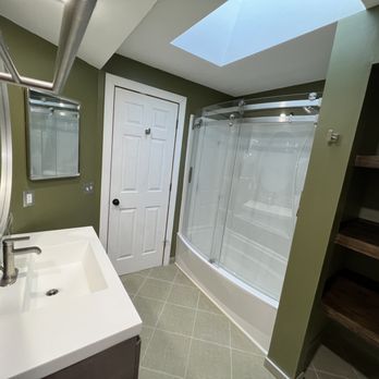 Arcos Mechanical - Hard to see, but they also made a closet for me and stained the shelves to match the vanity. - Plumbing Near Me