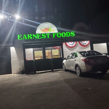 Earnest Foods - a car parked in front of a restaurant - Grocery Near Me - Queens, New York