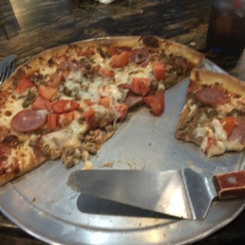Giuseppe's Italian Grill - Hamburger,pepperoni,Canadian bacon and fresh tomatoes on a 12 inch pizza - Italian Near Me - Seguin, Texas