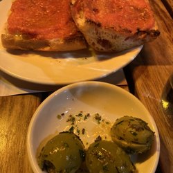 Tapas Brindisa - Stuffed olives and tomato garlic spread on toast.