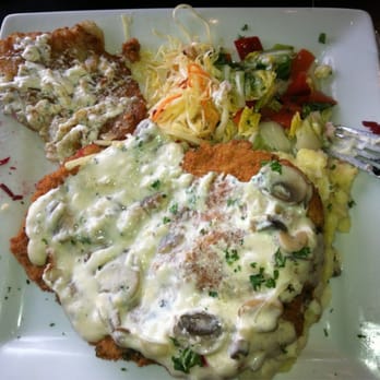 Old Vilnius Café - Breaded Pork Tenderloin with Mushroom Gravy, Mashed Potatoes, Potato Pancake and Salad. - Modern European Near Me - Darien, Illinois Old Vilnius Café - Breaded Pork Tenderloin with Mushroom Gravy, Mashed Potatoes, Potato Pancake and Salad. - Modern European Near Me - Darien, Illinois