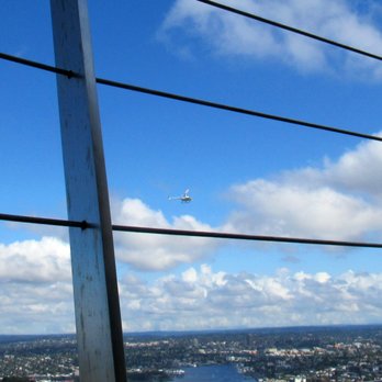 Space Needle - Helicopter flying by - Landmarks & Historical Buildings Near Me - Seattle, Washington Space Needle - Helicopter flying by - Landmarks & Historical Buildings Near Me - Seattle, Washington