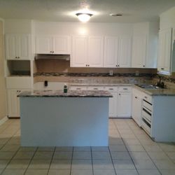 Krazy For Remodeling - Fresh paint, new countertops, build an island, hung light fixtures and new cabinet hardware.